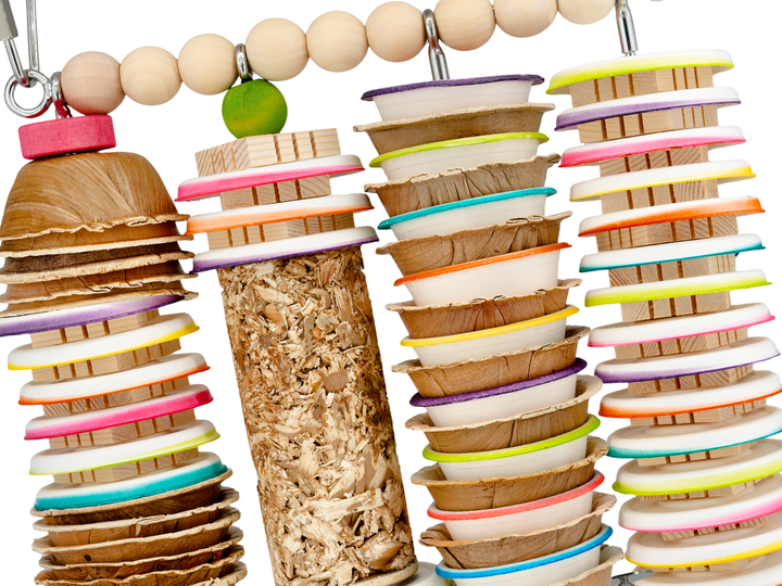 Colorful bird toy with shreddable toys